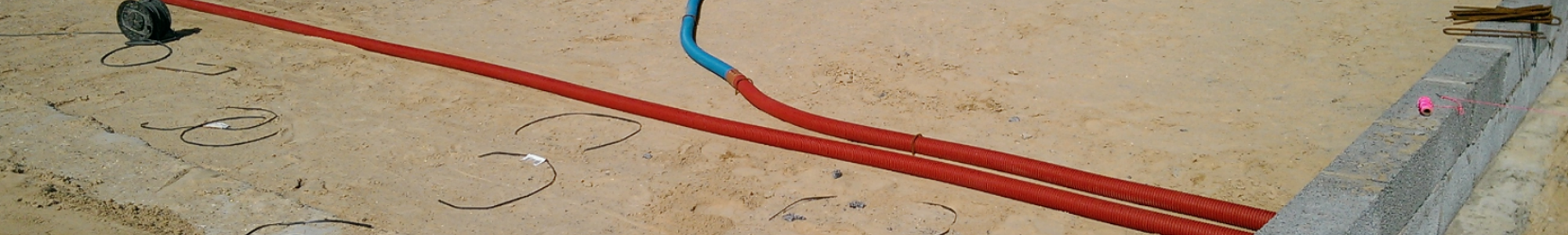 Construction Site With Earth And Plastic Pipes Ventilation
